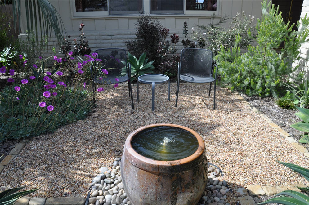 Water Fountain Urn in Gravel Courtyard